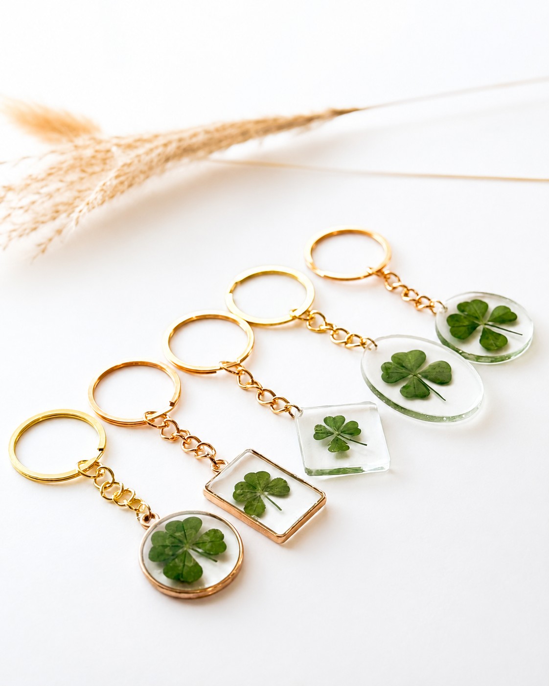 Real four-leaf clover keychains in gold frame and clear resin